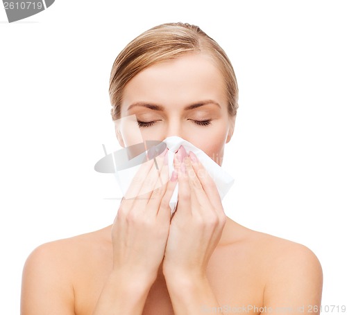 Image of beautiful woman with paper tissue