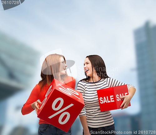 Image of smiling teenage girl with percent and sale sign
