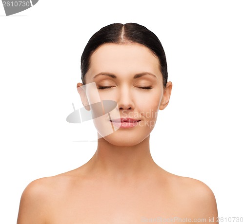 Image of young calm woman with closed eyes