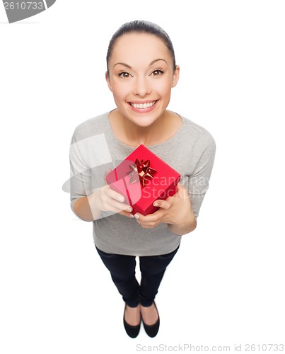 Image of smiling asian woman with red gift box