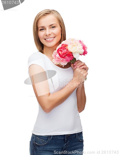 Image of smiling woman with bouquet of flowers