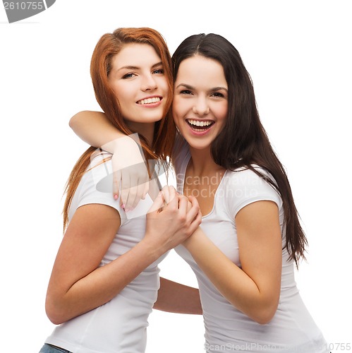 Image of two laughing girls in white t-shirts hugging