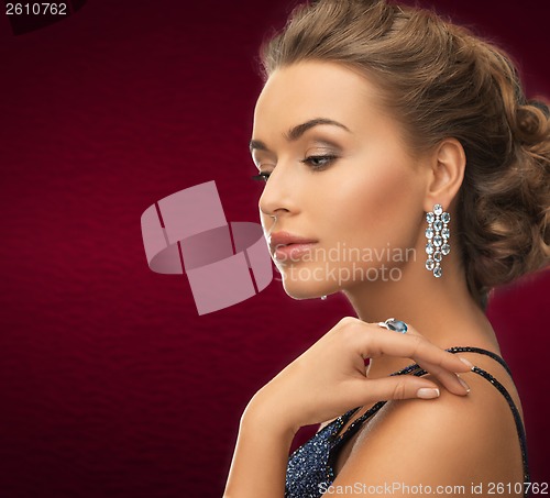 Image of woman with earrings and ring
