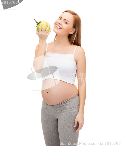 Image of happy future mother with green apple