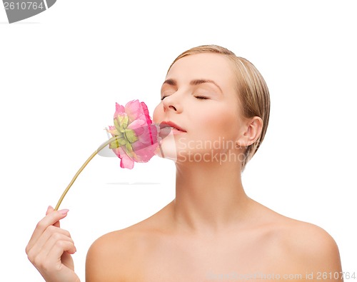 Image of lovely woman with peonie flower