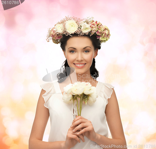 Image of woman wearing wreath of flowers