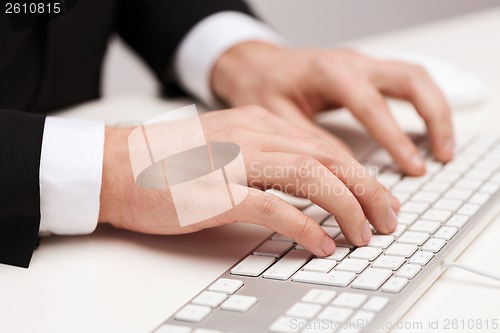 Image of businessman working with keyboard