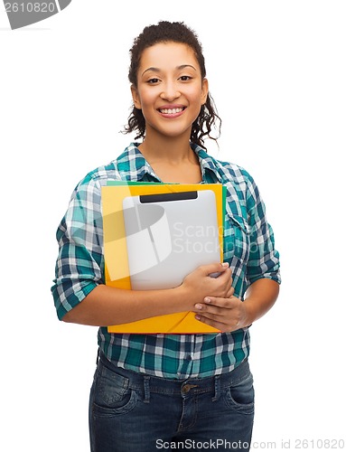 Image of smiling black student with folders and tablet pc