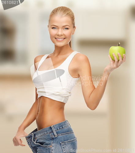 Image of sporty woman showing big pants