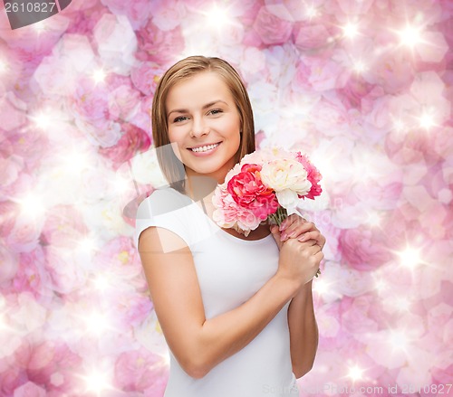 Image of smiling woman with bouquet of flowers