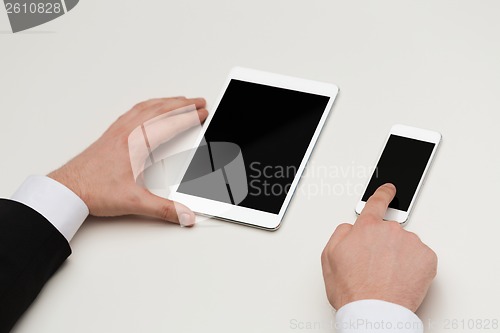Image of businessman working with table pc and smartphone