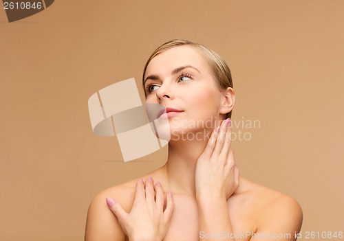 Image of face and hands of beautiful woman