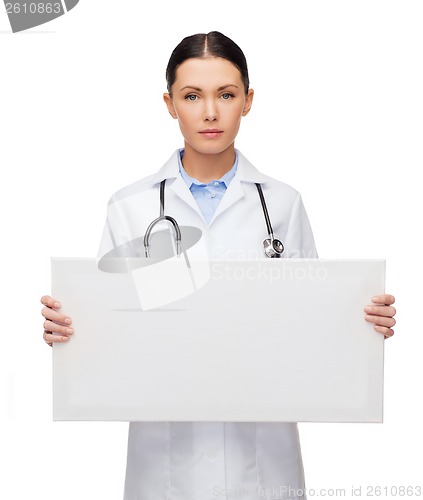 Image of female doctor with stethoscope and white board