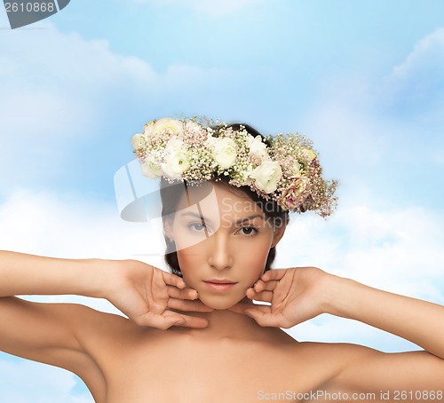 Image of beautiful woman wearing wreath of flowers