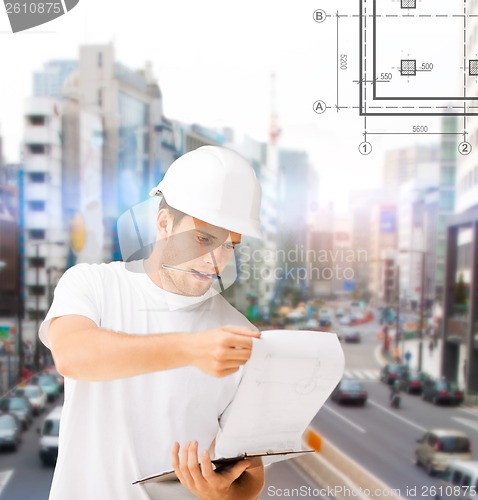 Image of male architect looking at blueprint