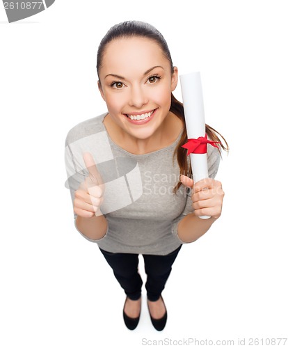 Image of happy woman with diploma showing thumbs up