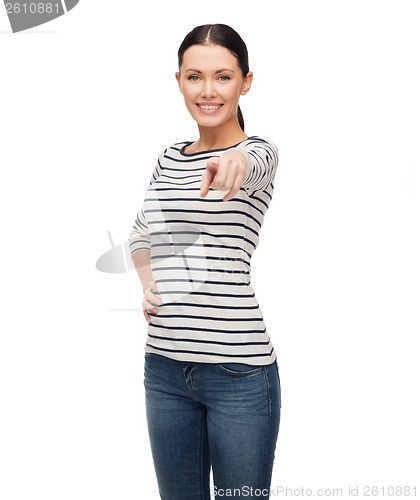 Image of smiling girl in casual clother pointing at you