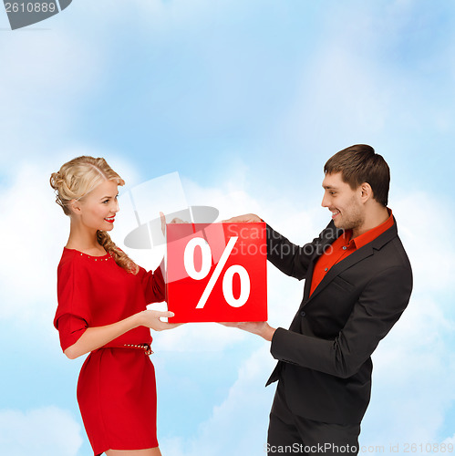 Image of smiling woman and man with red percent sale sign