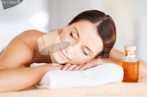 Image of happy woman in spa salon