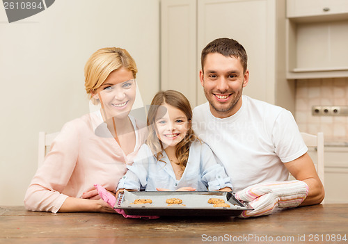 Image of happy family making cookies at home