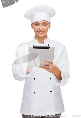 Image of smiling female chef with tablet pc computer