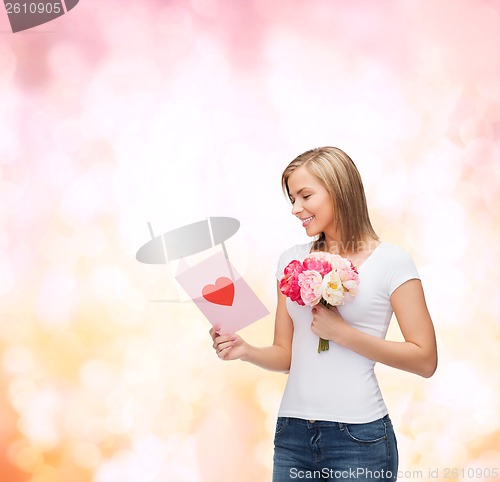 Image of smiling girl with postcard and bouquet of flowers