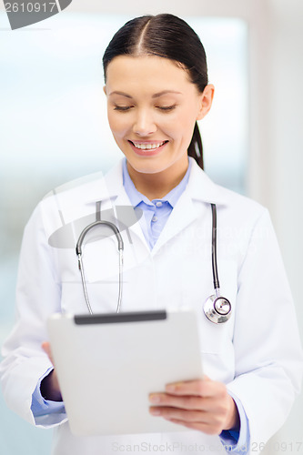 Image of young doctor with tablet pc and sthethoscope