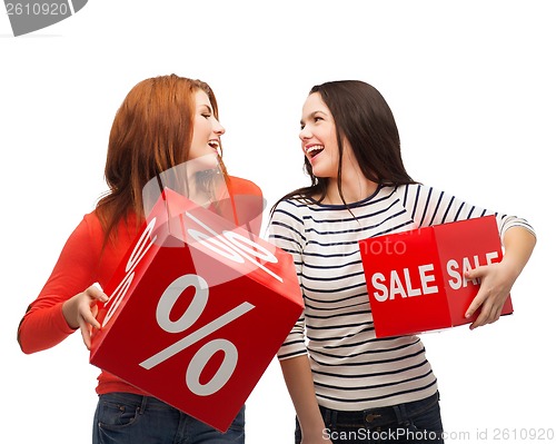 Image of smiling teenage girl with percent and sale sign