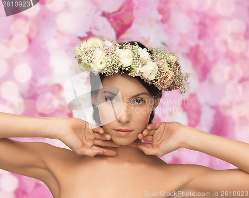 Image of beautiful woman wearing wreath of flowers