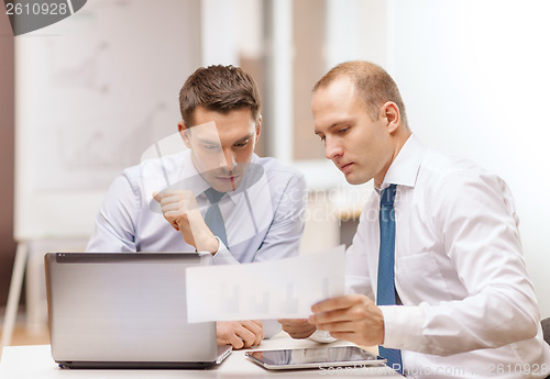Image of two businessmen having discussion in office
