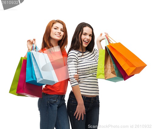 Image of two smiling teenage girls with shopping bags