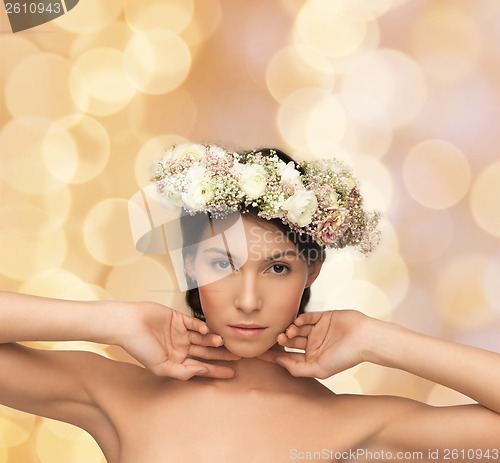 Image of beautiful woman wearing wreath of flowers