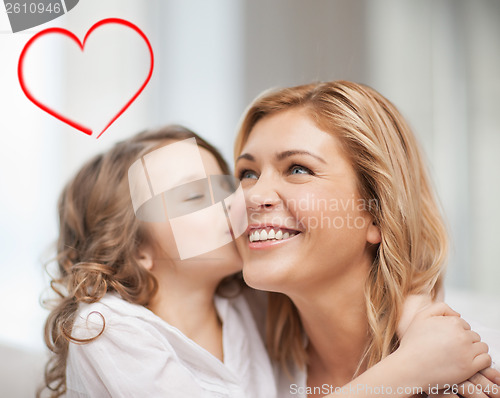 Image of smiling mother and daughter hugging