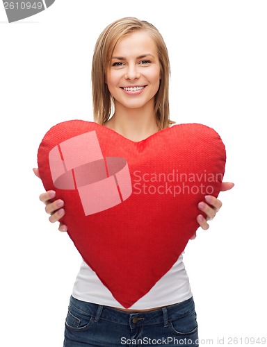 Image of smiling woman in white t-shirt with heart