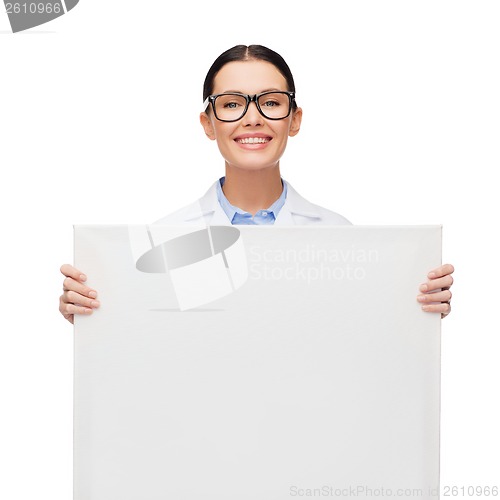 Image of female doctor in eyeglasses with white blank board