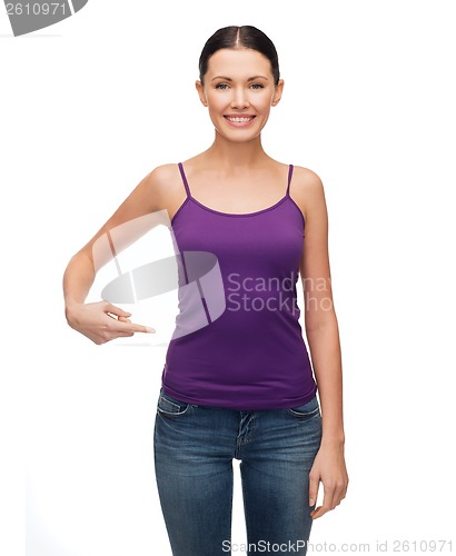 Image of woman in blank purple tank top pointing at herself