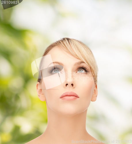 Image of beautiful woman looking up