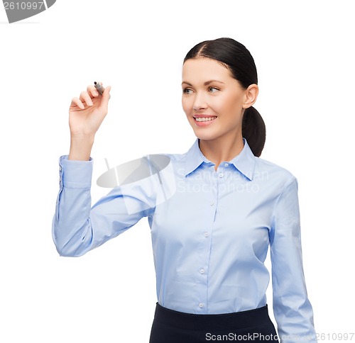 Image of businesswoman writing something in the air