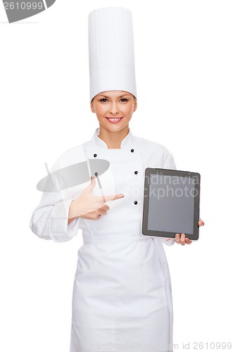 Image of smiling female chef with tablet pc blank screen