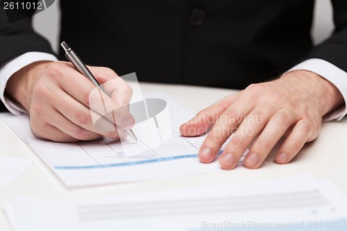 Image of close up of businessman with papers