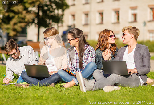 Image of students or teenagers with laptop computers