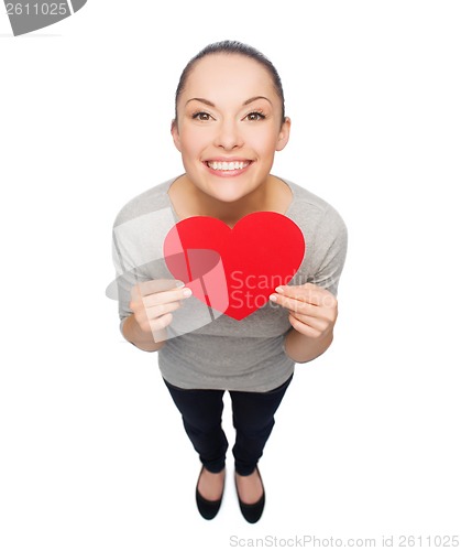 Image of smiling asian woman with red heart