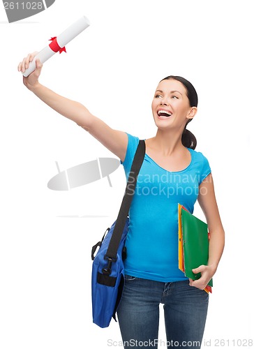 Image of smiling student with bag and folders