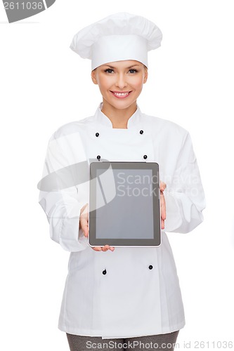 Image of smiling female chef with tablet pc blank screen