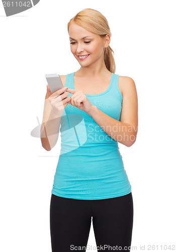 Image of sporty woman with smartphone