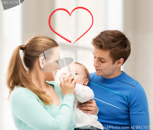 Image of family and adorable baby with feeding-bottle