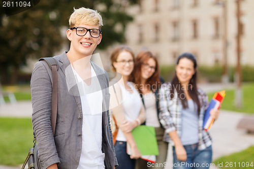 Image of teenage boy with classmates on the back