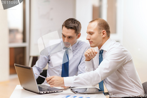 Image of two businessmen having discussion in office