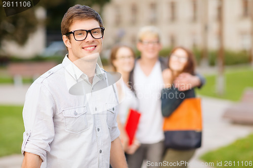 Image of teenage boy with classmates on the back