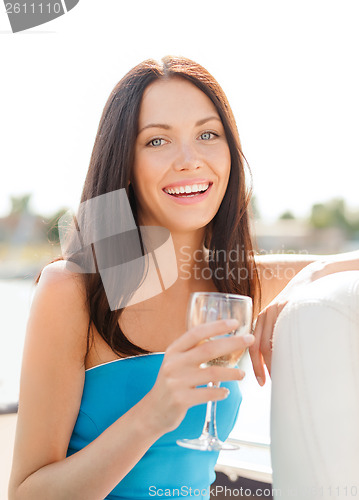Image of laughing girl with champagne glass